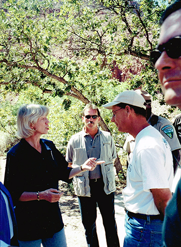 Gale Norton and John Weisheit along the Colorado River in 2004 discussing the potential option to improve critical habitat, water delivery and water quality by decommissioning Glen Canyon Dam.